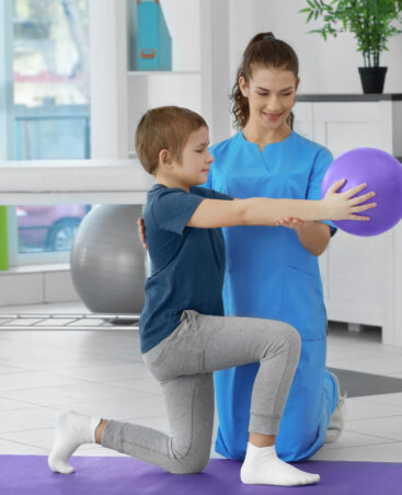 Physiotherapist working with patient in clinic