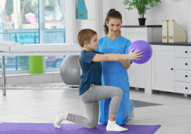 Physiotherapist working with patient in clinic